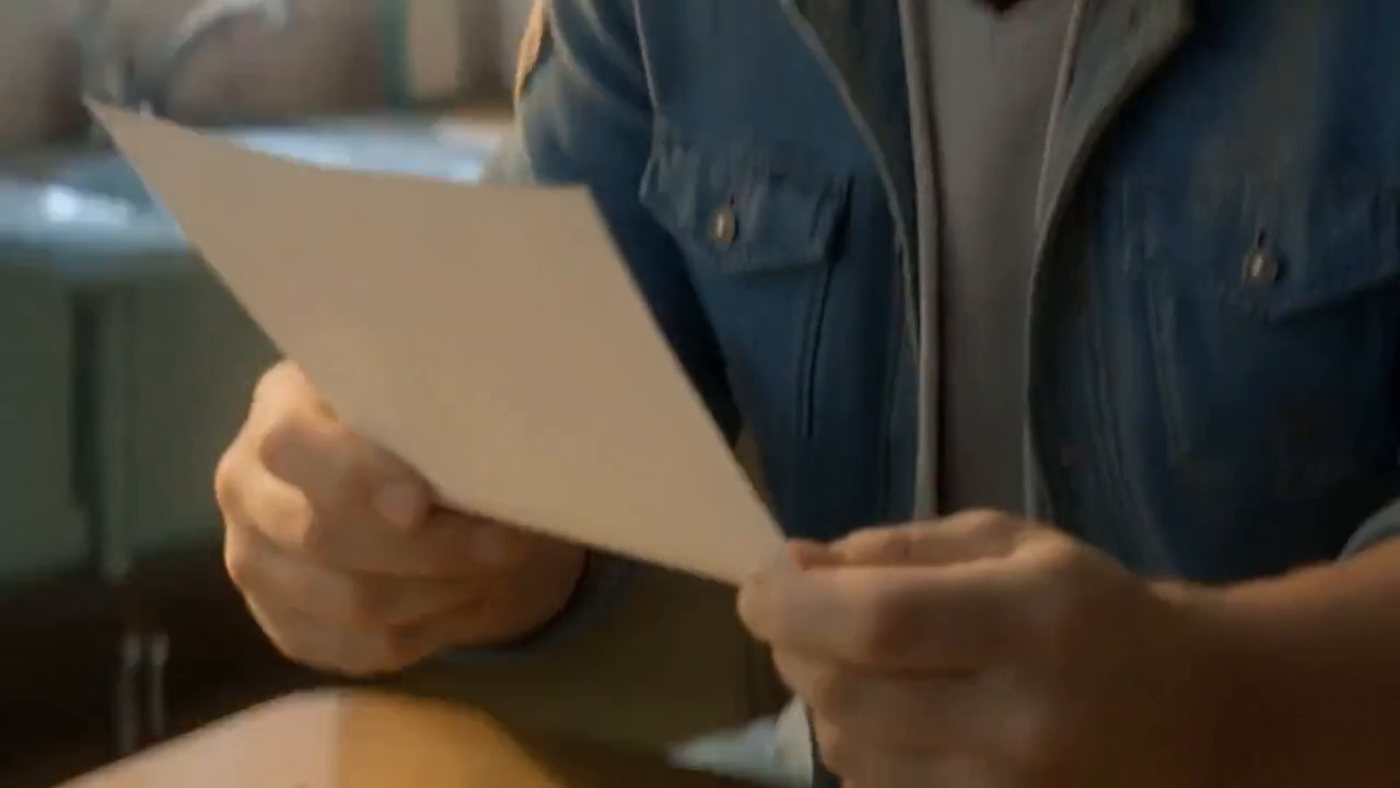 Reading the letter through, no music